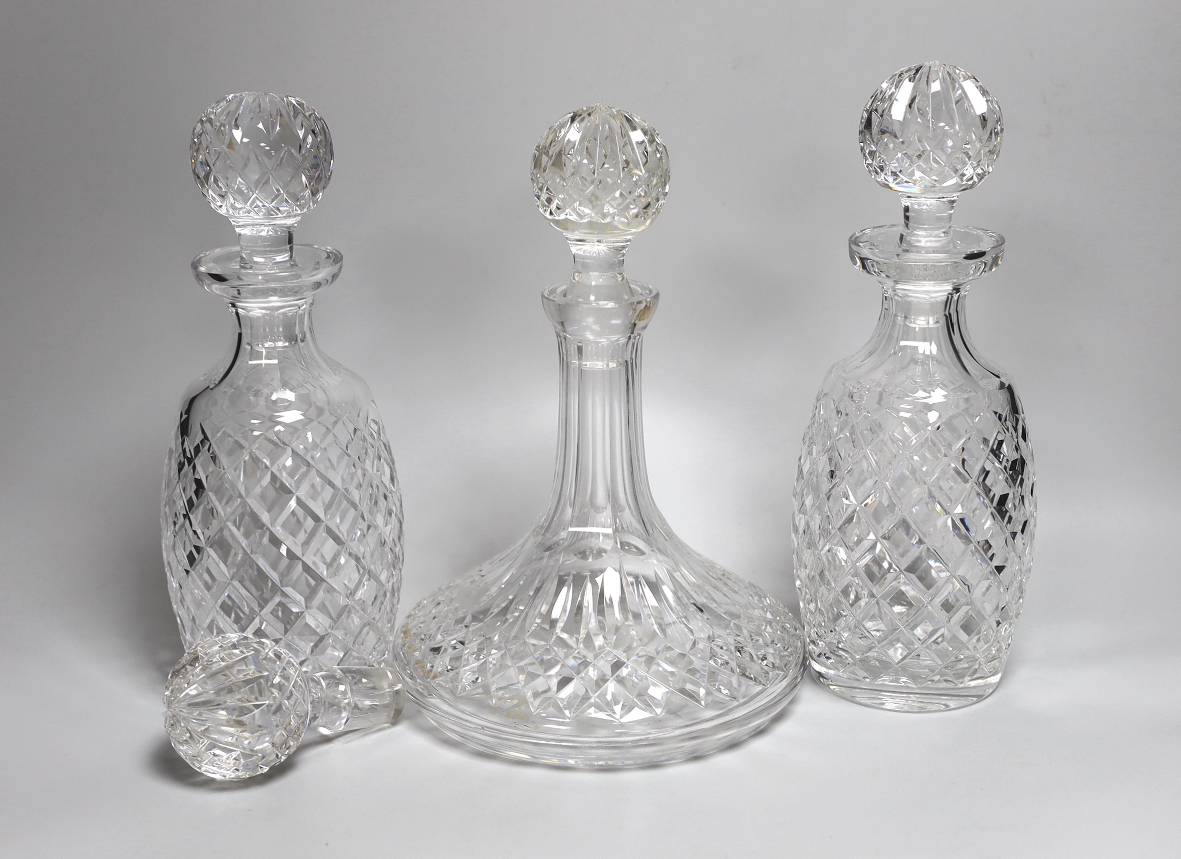 A pair of Waterford Colleen pattern decanters, a ships decanter a and four stoppers